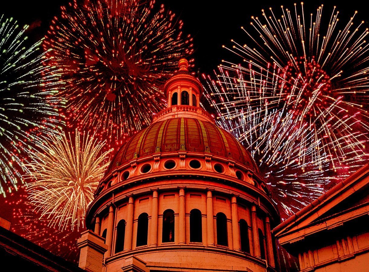Colorful fireworks burst over a modern tech building at night, symbolizing innovation and breakthrough in real-time WebRTC streaming.